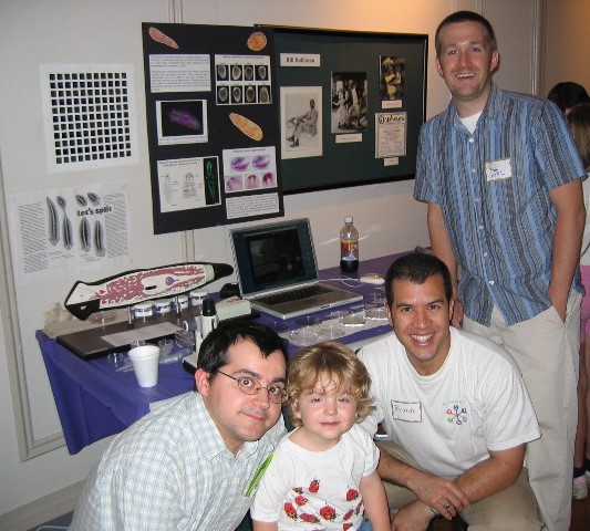 People Posing at a booth at Brain Awareness Day 2004