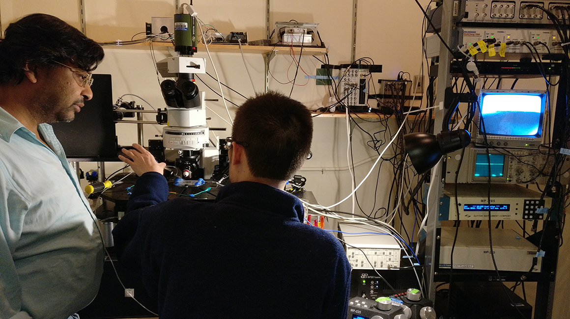 Llano and student at the lab