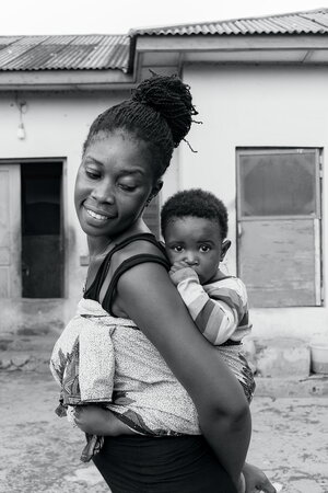 Mother Carrying Her Child
