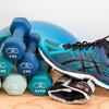 Blue gym shoe and blue weights