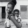 Mother Carrying Her Child